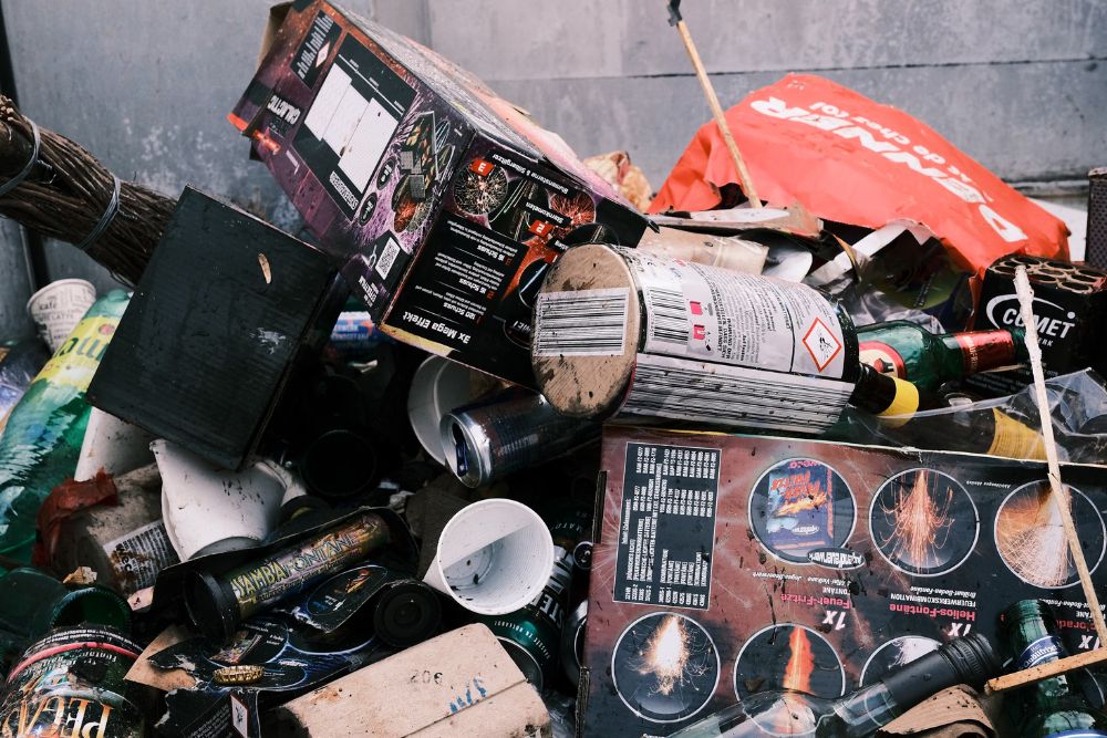 A cluttered table displaying a pile of trash and miscellaneous items, highlighting a clean-out service in Washington, DC.