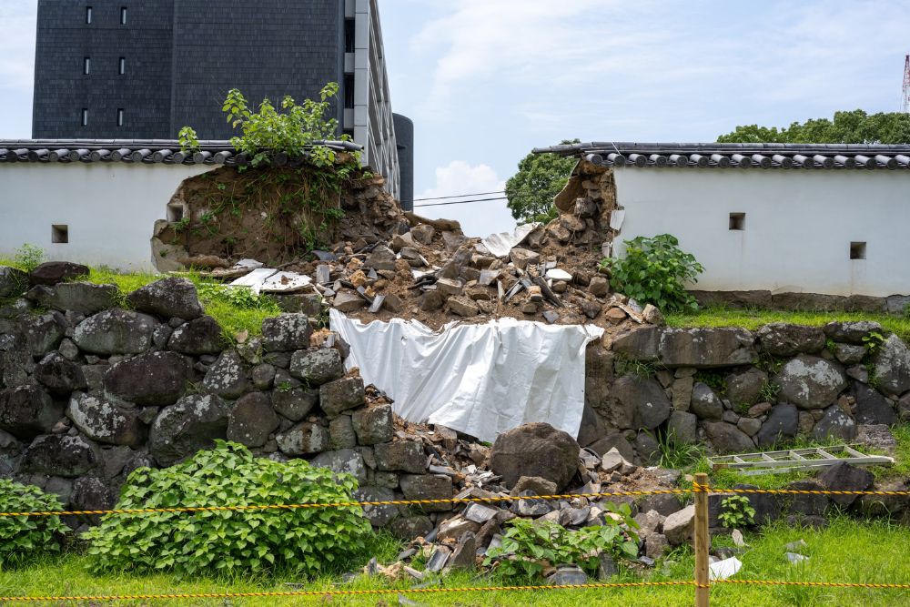 A pile of rubble in front of a building, indicating demolition work in Washington, DC.